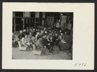 A story hour in a nursery class conducted by (right) Miss Sumi Kashiwagi. Photographer: Parker, Tom Amache, Colorado