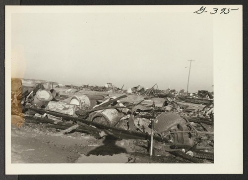 46 electric washing machines were destroyed in a Christmas night 1943 blaze in Block 202, Poston Unit II. Two mangles, 29 gas stoves, 8 electric refrigerators and an electric stove also were destroyed. The buildings served as warehouses for evacuee and personnel household goods. Poston, Arizona