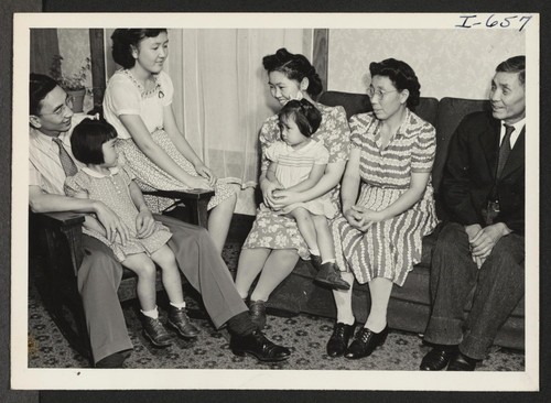 In the picture, from left to right, are: Sam Sakamoto, Lois, age 4 (on father's lap), Janet, Chiyo, Lousie, age