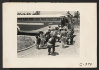 Stockton, Calif.--People of Japanese ancestry from the Lodi grape-producing district. Their identification numbers and family groups are checked by officials