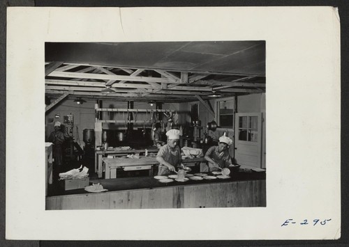 The kitchen section at work preparing dinner for Block 7, in the early afternoon. Photographer: Parker, Tom Denson, Arkansas