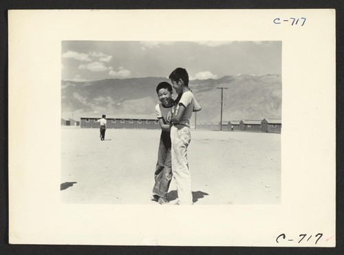 Manzanar, Calif.--Young evacuees of Japanese ancestry at this War Relocation Authority center. Photographer: Lange, Dorothea Manzanar, California