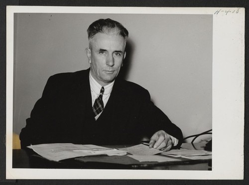 John H. Putz is the Relocation Officer for the State of Wisconsin with headquarters in Milwaukee. Photographer: Mace, Charles E. Milwaukee, Wisconsin