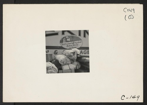 Hayward, Calif.--Baggage of evacuees of Japanese ancestry ready to be loaded on moving van. Evacuees will be housed in War Relocation Authority centers for the duration. Photographer: Lange, Dorothea Hayward, California