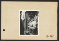 Poston, Ariz.--(Site No. 1) Evacuees of Japanese ancestry are given a preliminary medical examination upon arrival at War Relocation Authority centers where they will spend the duration. Photographer: Clark, Fred Poston, Arizona