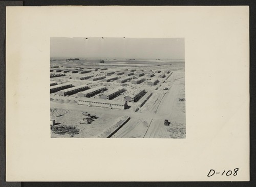 Eden, Idaho--A panorama view of the Minidoka War Relocation Authority center. This view, taken from the top of the water tower at the east end of the center, shows partially completed barracks. Photographer: Stewart, Francis Hunt, Idaho