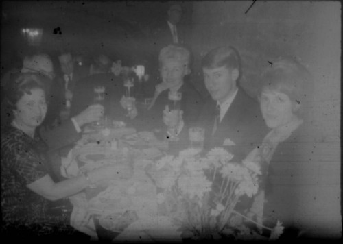 Alice Peters and others gathered around a table