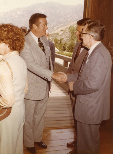 Justice Harry A. Blackmun and President Banowsky greeting a guest (Color)