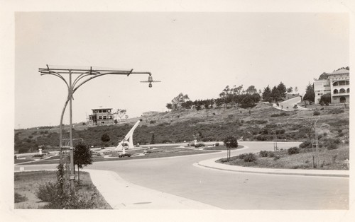 Light standard without vines; also large sundial, Ingleside Terraces