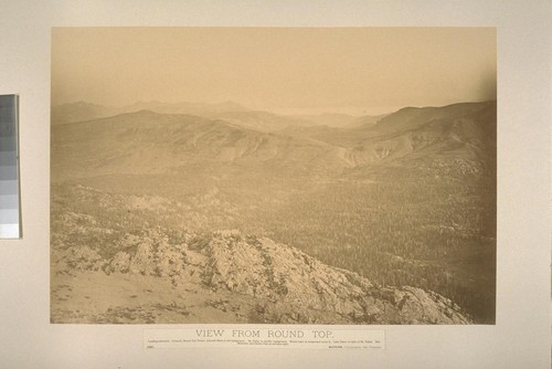 View from Round Top. Looking westward. Pyramid, Round Top Proper, Azimuth Mark in left background. Mt. Tallac in middle background. Woods Lake in foreground under it. Lake Tahoe to right of Mt. Tallac. Red Mountain and Carson Pass on extreme right