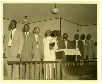 Group of men standing at church altar