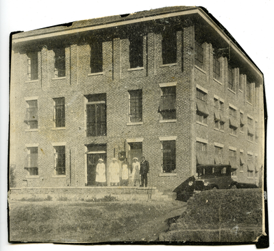 James R. Sheppard and four nurses standing outside of hospital