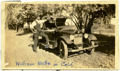 William Watts standing next to car