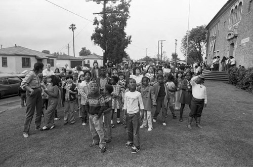 Ritter Elementary School children looking toward the sky, Watts (Los Angeles, Calif.), 1983
