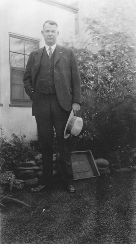 Andrew P. Hill, Jr. standing in the yard