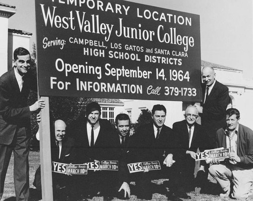 Temporary location sign for West Valley Junior College at Campbell Grammar School location, 1964, with Board members and administrators