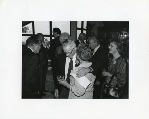 Wally Simpson, Eleanor Gehrig Harper with glasses (Center), Dr. William Allen (L) with several others at the 1941 Reunion at the home of Chancellor Emeritus Young (Pose 1)