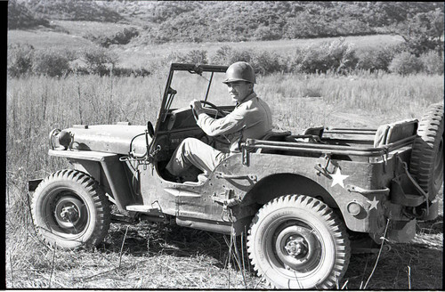 Corporal in a jeep