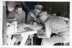 Soldiers at table in military camp — Calisphere