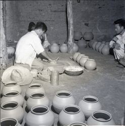 Potter at work with pottery wheel