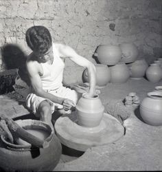 Potter at work with pottery wheel