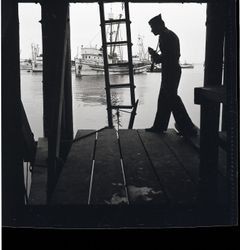 Army photographer at a Monterey marina