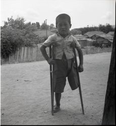 Boy with missing leg — Calisphere