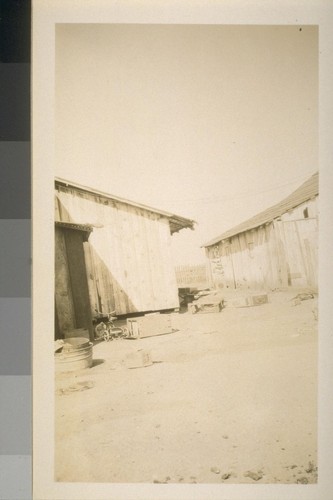 Snapshots of laborers and buildings, location unknown