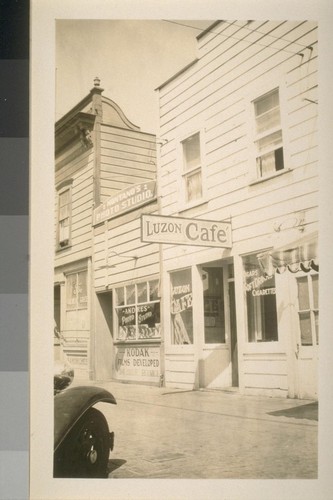 Snapshots of laborers and buildings, location unknown: Shows the Luzon Cafe