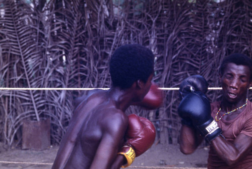 Boxers fighting in the ring, San Basilio de Palenque, 1976
