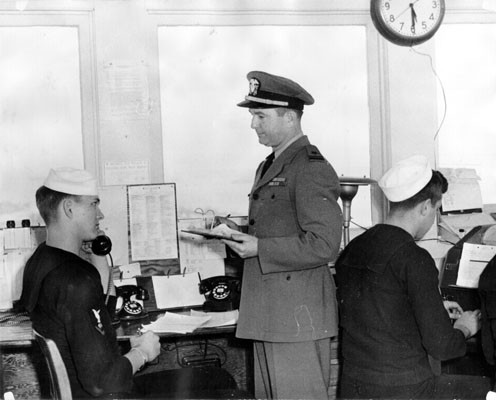 [Signalman Carl J. Waller, Lieutenant John G. Worth and Signalman John Grosse at the Navy's lookout and signal station on Yerba Buena Island]