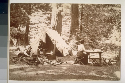 [Unidentified men and woman at campsite]