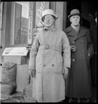 1st Day War. Air raid warden, with aluminum casserole pan strapped to head as helmet. 10:30 a.m