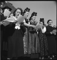 Choeur. Peasants singing [Alsatian choir. Comite Americain de Secours Civil. Bellac, France]