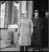 1st Day War. Air raid warden, with aluminum casserole pan strapped to head as helmet. 10:30 a.m