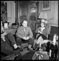 [Officer (Major) with civilians drinking champagne in a well-furnished sitting room] [Filed with: Wood Gathering]