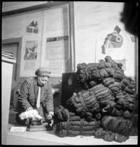 [Ammerschwihr: TB Village. Thérèse Bonney in office with supply of wool yarn.]