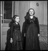 In Bellac house. Two little girls standing [Girls in Alsatian dress. Bellac, France]