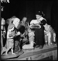 [Miscellaneous Numbered Negatives: boy in traditional Alsatian suit among large Christmas nativity scene.]