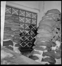 Viipuri Hospital [Sandbags stacked at entrance] "Nearest field hospital to one of the Finnish fronts constantly under menace of air raids..."