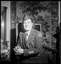 [Thérèse Bonney in France, seated, in US war correspondent uniform]