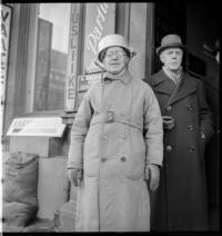 1st Day War. Air raid warden, with aluminum casserole pan strapped to head as helmet. 10:30 a.m