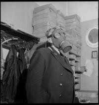 1st Day War [Government Palace. Ministry of Foreign Affairs. Man (clerk) wearing gas mask]