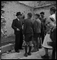 [Ostheim: group of children at ruined building site]