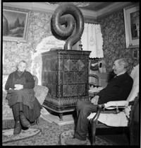 [Elderly couple in war-damaged village home: Emile Schmidt and wife in Ammerschwihr?]