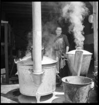 Lisieux: Cantine. Preparing food [Woman cooking. Lisieux, France]