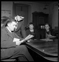 [Miscellaneous (Ammerschwihr?): Mayor roth reading with family at table]