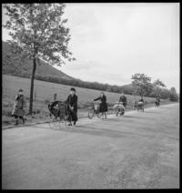 Ardennes evacuation: On road. Bicycles, buggies on road [Refugees]
