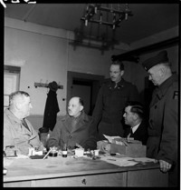 [Miscellaneous (Ammerschwihr?): five men, most in uniform (American officers?), including Colonel Gerry and Hartman.]