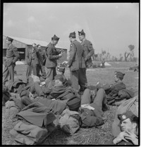 [US soldiers (Airborne) at airfied, probably departing on leave for Nice, in the United States Riviera Rest Area (USRRA).] [Misidentified in logbooks as part of: Ordonnance Reims series.]